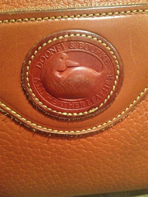 dooney and bourke wristet real or fake|dooney & bourke large wristlet.